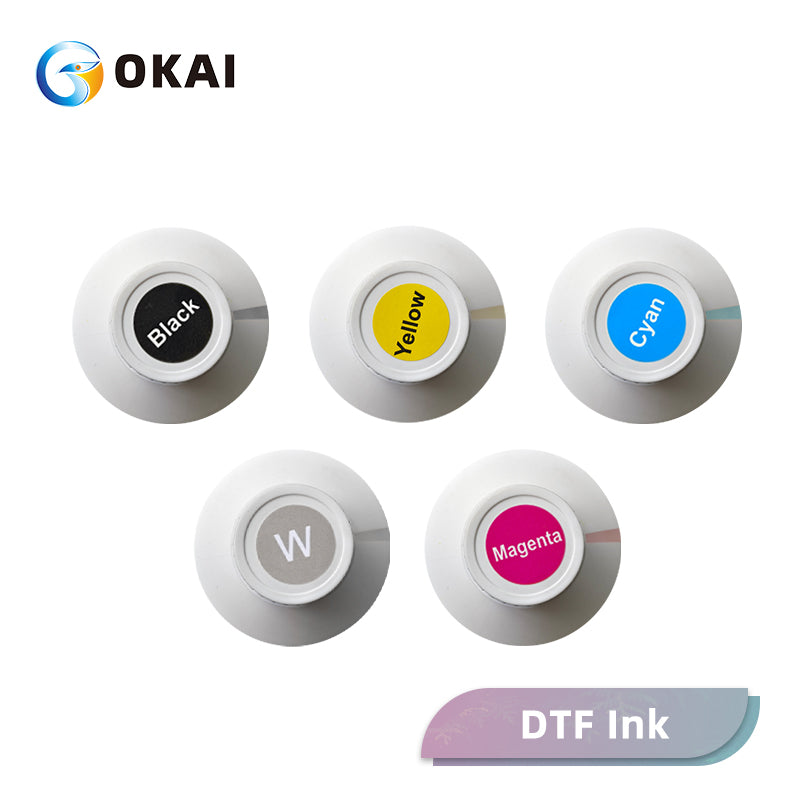 DTF ink bottle caps labeled black yellow cyan white and magenta